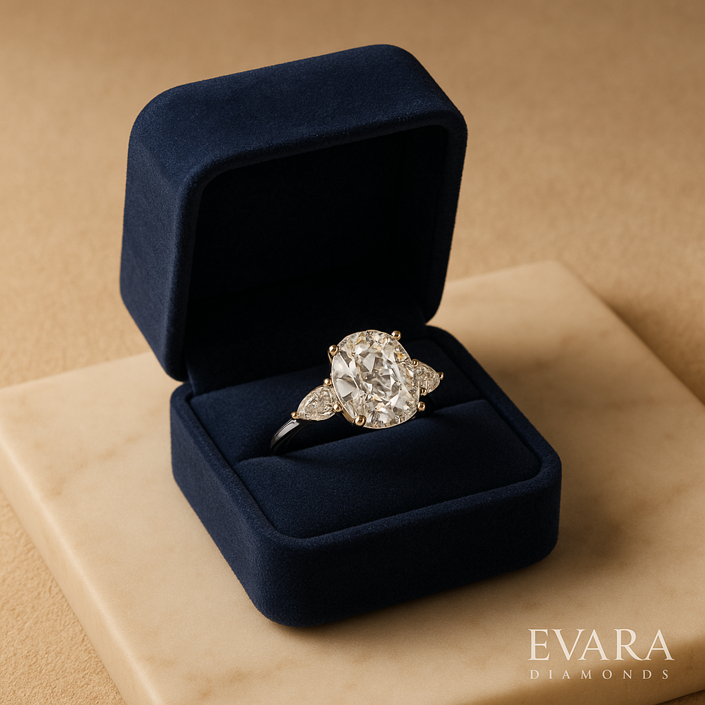 Engagement ring featuring a cushion diamond with pear side stones, symbolizing unique diamond shapes.
